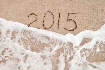 Year 2015 wash away - beach concept for happy new year 2015