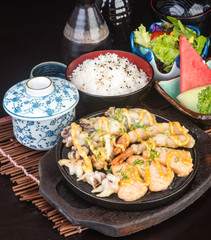 japanese cuisine. hot plate sea food on the background
