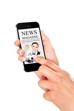hand holding mobile phone with news magazine isolated over white