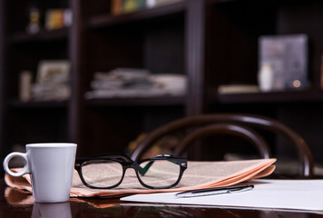Cup of Coffee and Newspaper