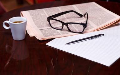 Cup of Coffee and Newspaper