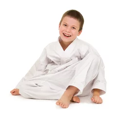 Foto auf Acrylglas Kampfkunst Junge in Kleidung für den Kampfsport