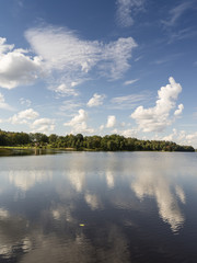 reflection of clouds in the lake with boardwalk