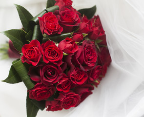 wedding bouquet of red roses and leaves