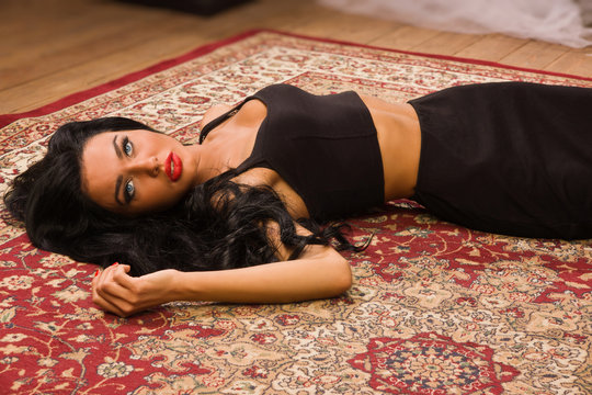 Sensual unconscious woman lying on the floor