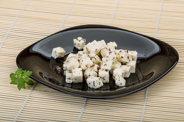 Cheese with spices and oil