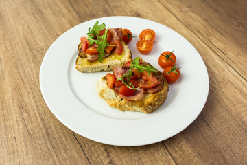 Plate With Italian Bruschetta On Table