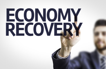 Business man pointing the text: Economy Recovery