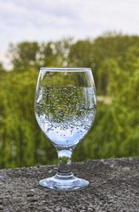 The  shot glass with sparkling water