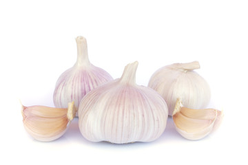 Garlic bulb and cloves on white background