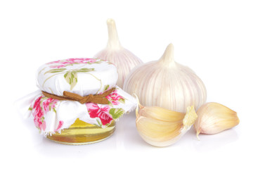 garlic bulbs and jar of honey as healthy eating