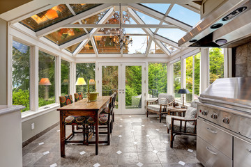 Sunroom patio area with transparent vaulted ceiling