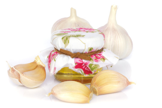 garlic bulbs and jar of honey as healthy eating