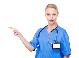 Woman doctor with finger point aside