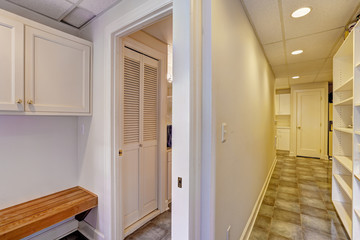Basement interior. Long corridor with tile floor