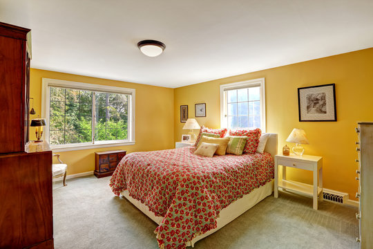 Cheerful bedroom interior in bright yellow color