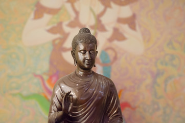 Buddha sculptre on thai mural background patterns Thailand