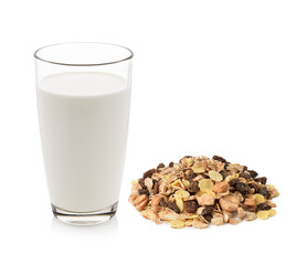 pile of muesli and fresh milk in the glass isolated on white bac