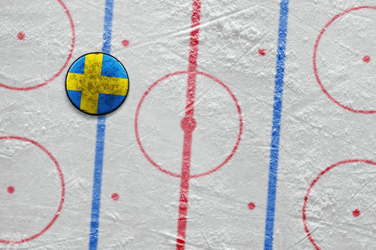 Swedish hockey puck lying on the floor