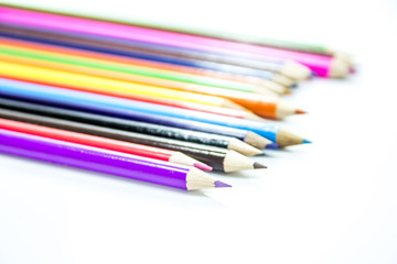 Colored pencils on white background
