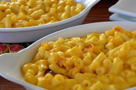 Traditional baked macaroni pasta and cheddar cheese dish
