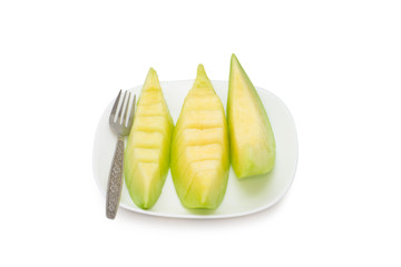 cantaloupe melon fruit in dish Isolated on white background