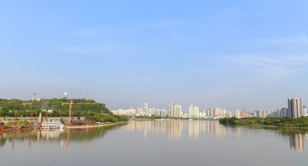 Obraz premium modern city near the river