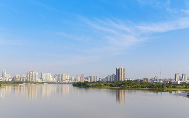 Fototapeta premium modern city near the river