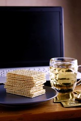 Soda Crackers, cup of tea and a computer