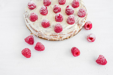 Obraz na płótnie Canvas Raspberry cake on a white desk