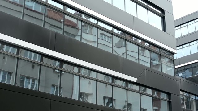 modern building - offices - windows - moderate rain