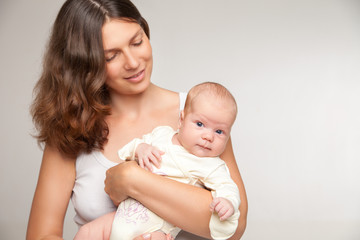 happy mother holding and hugging her baby