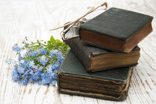 Forget-me-nots flowers and old books