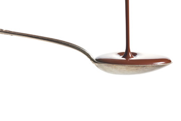 Chocolate poured into a spoon