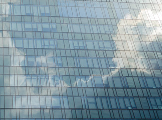 Fototapeta na wymiar Cloud reflect on building