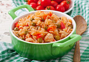 Pilaf with chicken, carrot and green peas