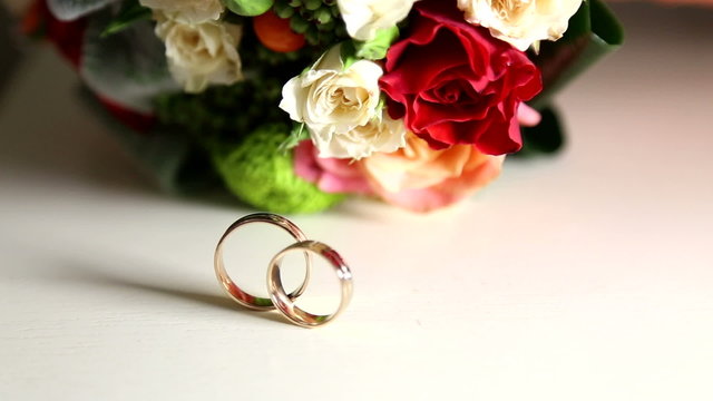 Wedding rings and wedding bouquet.