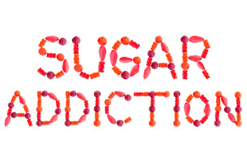 Words "SUGAR ADDICTION" made of red sugary candies, isolated