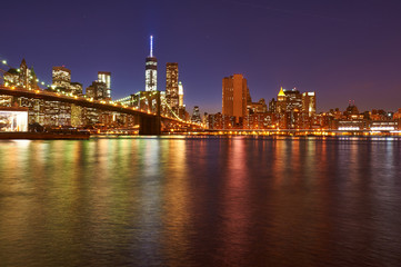 Naklejka na ściany i meble Brooklyn Bridge with lower Manhattan skyline at night