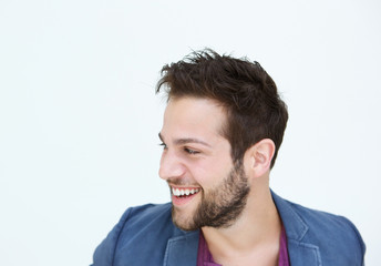 Fototapeta premium Trendy young man smiling on white background