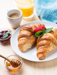 breakfast with croissants,coffee and juice