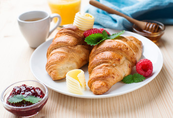 breakfast with croissants,coffee and juice