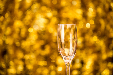One champagne glass on christmas bokeh background ackground