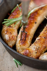 fried sausages on a frying pan