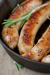 fried sausages on a frying pan