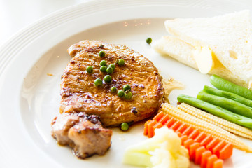 Pork steak with fresh green pepper grains