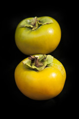 Persimmons on black