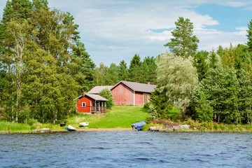 Fototapeta premium Cottage by the lake in rural Finland