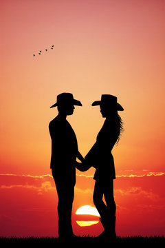 cowboy and cowgirl at sunset