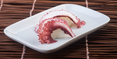 japanese cuisine. sushi octopus on the background